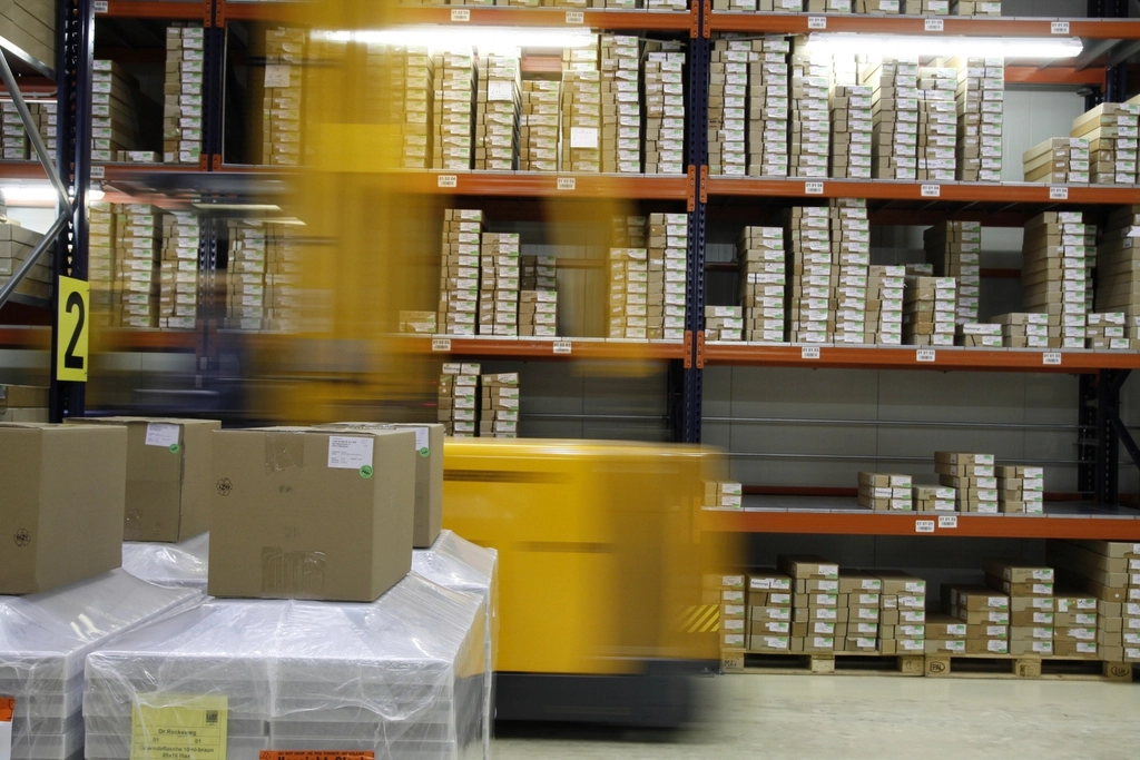 Warehouse shelves stocked with boxed inventory